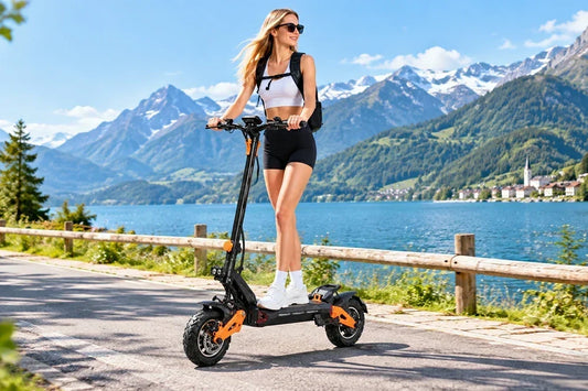 Woman with sunglasses riding Freeboy H9 electric scooter on lakeside mountain road